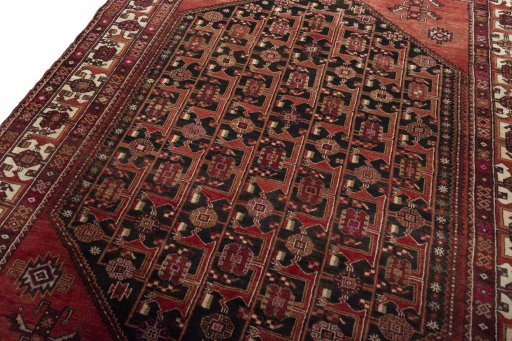 Backside of handmade 1970s Hamedan rug showing knot structure and weave density
