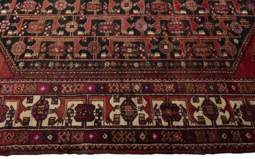 Close-up detail of 1970s Hamedan rug from Iran / Persia showing Wool weave
