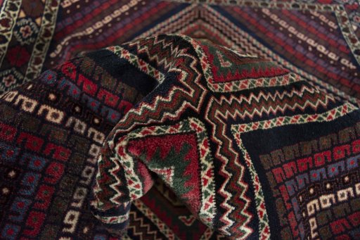 Corner detail of 2000s Hamedan rug showing border pattern and Wool pile