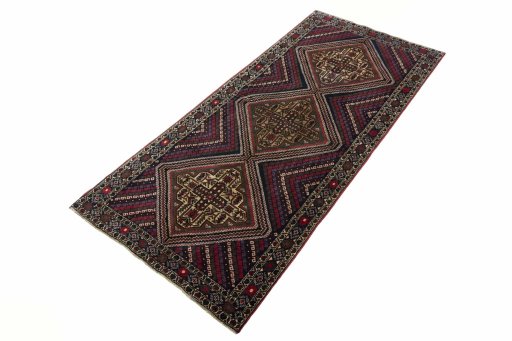 Corner detail of 2000s Hamedan rug showing border pattern and Wool pile
