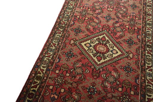 Backside of handmade New Hamedan rug showing knot structure and weave density