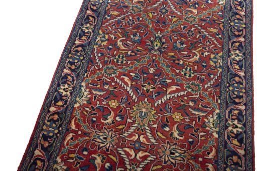 Backside of handmade New Hamedan rug showing knot structure and weave density