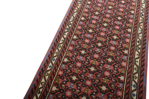 Backside of handmade New Hamedan rug showing knot structure and weave density