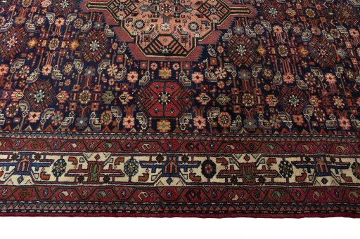 Corner detail of 2000s Hamedan rug showing border pattern and Wool pile