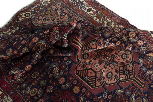 Surface texture of 2000s Hamedan rug with natural Wool and intricate pattern