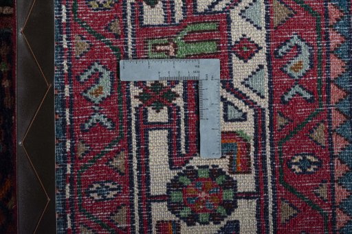 Backside of handmade 2000s Hamedan rug showing knot structure and weave density