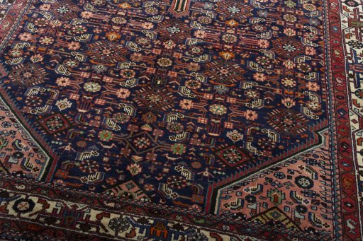 Close-up detail of 2000s Hamedan rug from Iran / Persia showing Wool weave