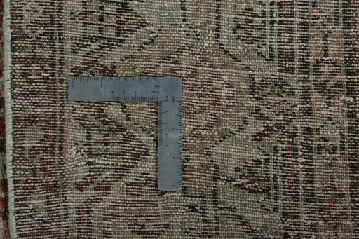 Backside of handmade 1950s Hamedan rug showing knot structure and weave density