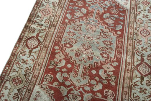 Backside of handmade 1950s Hamedan rug showing knot structure and weave density