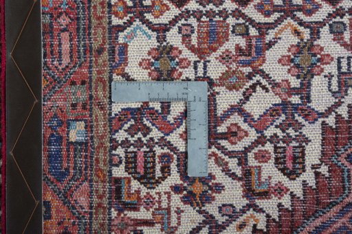 Surface texture of 2000s Hamedan rug with natural Wool and intricate pattern
