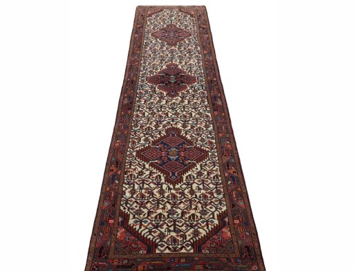 Surface texture of 2000s Hamedan rug with natural Wool and intricate pattern