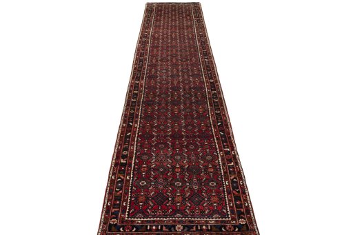 Surface texture of 2000s Hamedan rug with natural Wool and intricate pattern