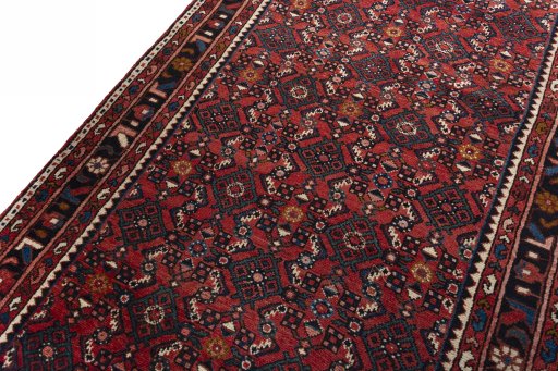 Backside of handmade 2000s Hamedan rug showing knot structure and weave density