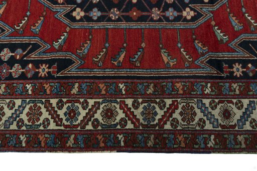 Corner detail of 1930s Hamedan rug showing border pattern and Wool pile