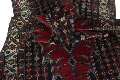 Surface texture of 1930s Hamedan rug with natural Wool and intricate pattern