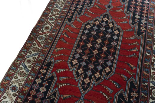 Backside of handmade 1930s Hamedan rug showing knot structure and weave density