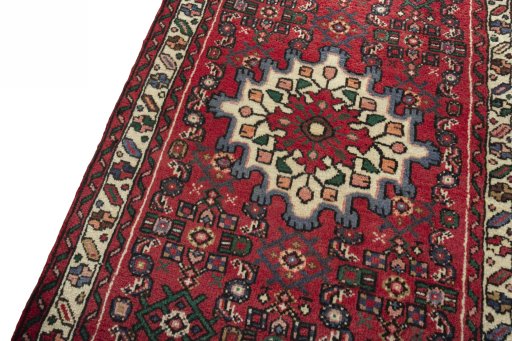 Backside of handmade New Hamedan rug showing knot structure and weave density