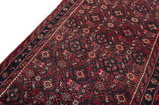 Backside of handmade New Hamedan rug showing knot structure and weave density