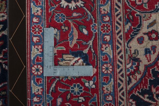 Backside of handmade New Hamedan rug showing knot structure and weave density