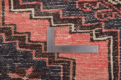Corner detail of 1960s Hamedan rug showing border pattern and Wool pile