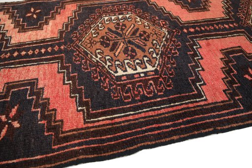 Backside of handmade 1960s Hamedan rug showing knot structure and weave density