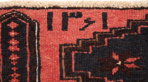 Close-up detail of 1960s Hamedan rug from Iran / Persia showing Wool weave