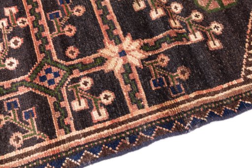 Backside of handmade 1973s Hamedan rug showing knot structure and weave density