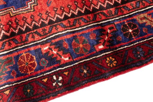 Backside of handmade 1970s Hamedan rug showing knot structure and weave density