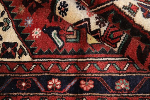 Corner detail of 1990s Hamedan rug showing border pattern and Wool pile