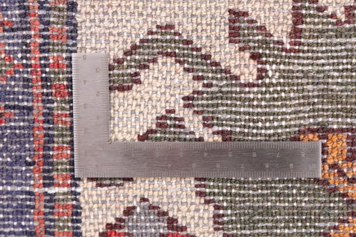 Corner detail of 1975s Hamedan rug showing border pattern and Wool pile