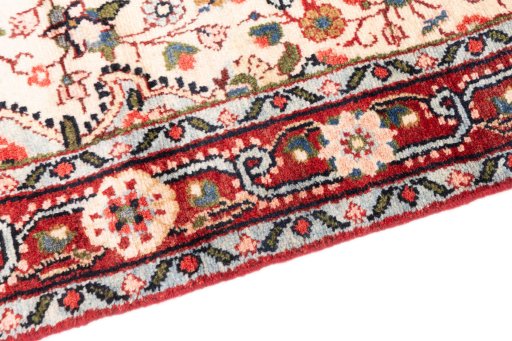 Backside of handmade 1970s Hamedan rug showing knot structure and weave density