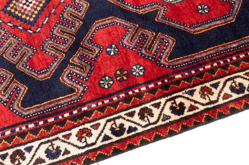 Backside of handmade 1996s Hamedan rug showing knot structure and weave density
