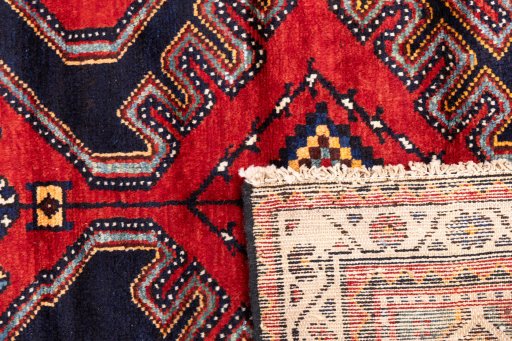 Close-up detail of 1996s Hamedan rug from Iran / Persia showing Wool weave