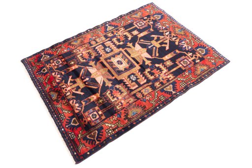 Corner detail of 1970s Hamedan rug showing border pattern and Wool pile