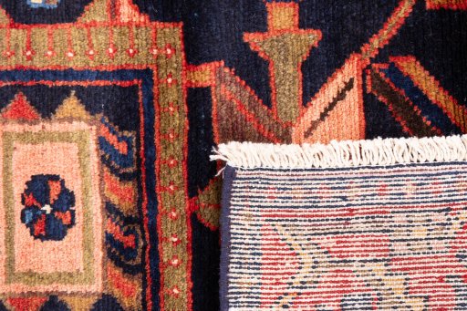 Close-up detail of 1970s Hamedan rug from Iran / Persia showing Wool weave