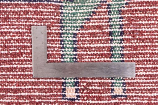 Corner detail of 1996s Hamedan rug showing border pattern and Wool pile