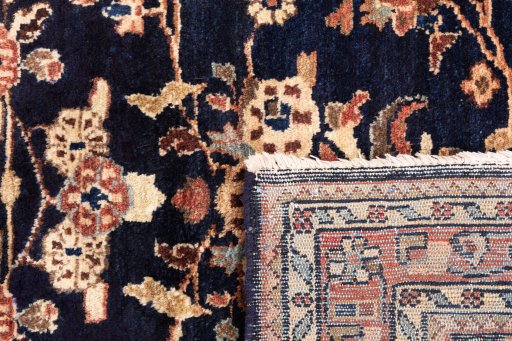 Close-up detail of 2001s Hamedan rug from Iran / Persia showing Wool weave