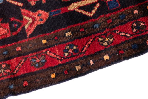 Backside of handmade 1990s Hamedan rug showing knot structure and weave density