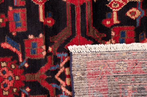 Close-up detail of 1990s Hamedan rug from Iran / Persia showing Wool weave