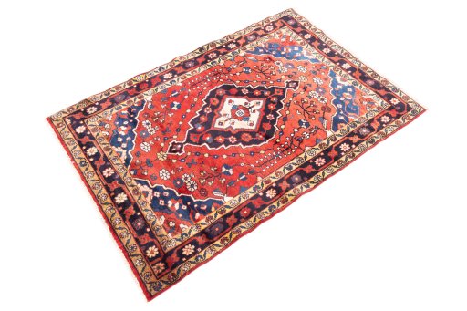 Corner detail of 1970s Hamedan rug showing border pattern and Wool pile