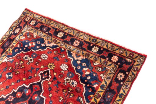 Surface texture of 1970s Hamedan rug with natural Wool and intricate pattern
