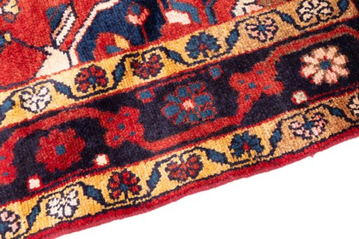 Backside of handmade 1970s Hamedan rug showing knot structure and weave density