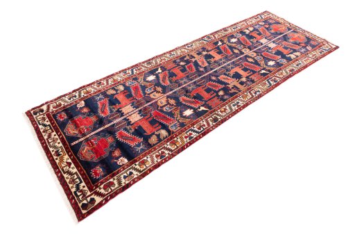 Corner detail of 1970s Hamedan rug showing border pattern and Wool pile