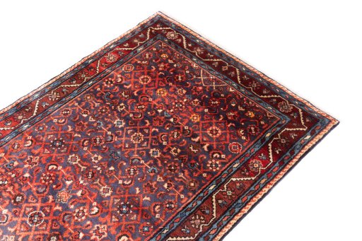 Surface texture of 1986s Hamedan rug with natural Wool and intricate pattern
