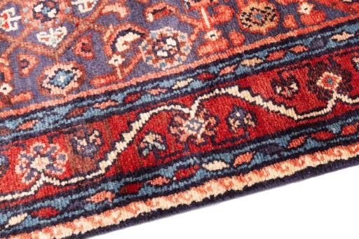Backside of handmade 1986s Hamedan rug showing knot structure and weave density