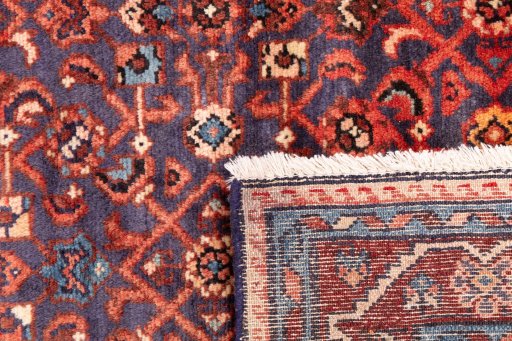 Close-up detail of 1986s Hamedan rug from Iran / Persia showing Wool weave