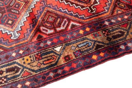 Backside of handmade 1997s Hamedan rug showing knot structure and weave density