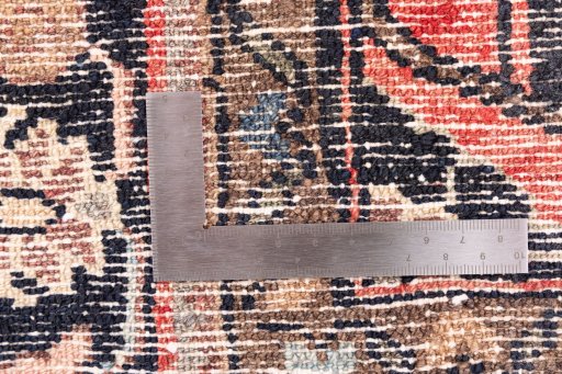 Corner detail of 1970s Hamedan rug showing border pattern and Wool pile