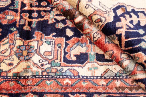 Corner detail of 1980s Hamedan rug showing border pattern and Wool pile