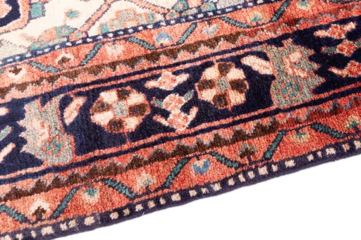 Backside of handmade 1980s Hamedan rug showing knot structure and weave density